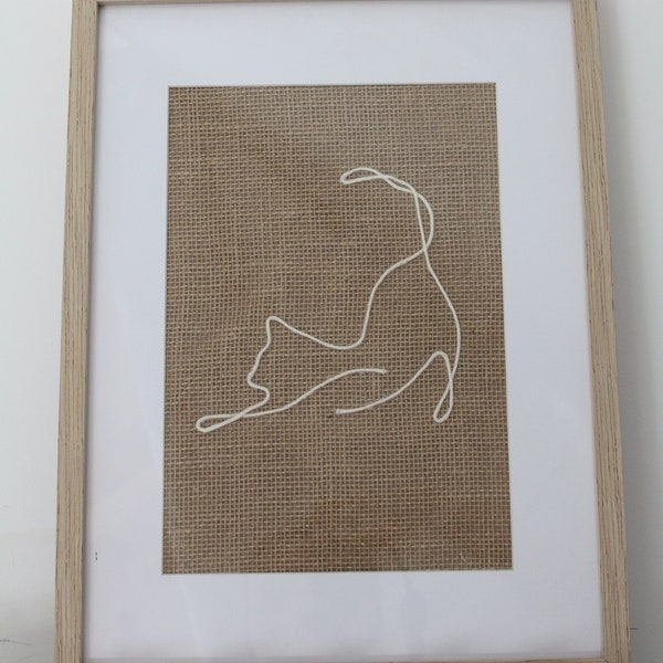 Chat sur toile de jute