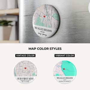 May include: A round, white magnet with a map design and the text "WO ALLES BEGANN" and "06.11.2025". The map features a red heart marking a location. Below are two additional map color style options: vintage and vibrant.