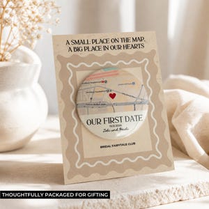 May include: A personalized gift card with a map design. The card features the text "A SMALL PLACE ON THE MAP, A BIG PLACE IN OUR HEARTS" and "OUR FIRST DATE" with a date and names. The card is packaged for gifting.