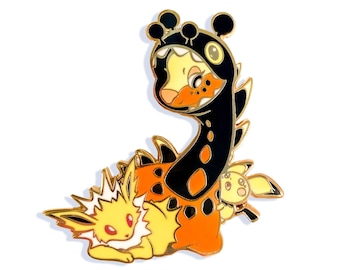 May include: A gold-colored enamel pin featuring a cartoon character in a giraffe costume. The giraffe costume is black and orange, with a yellow face. Two other yellow cartoon characters are also present. The pin has a glossy finish.