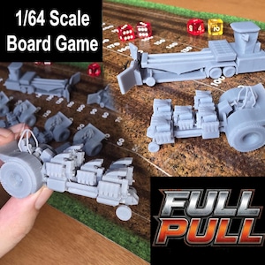 May include: A collection of gray 1/64 scale board game pieces, including a tractor-trailer and other vehicle components, arranged on a brown game board with dice. The text "1/64 Scale Board Game" and "FULL PULL" are also visible.