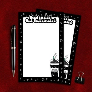 May include: Three black and white notepads with a skull and star pattern border. The top notepad has the text "Dead Inside But Caffeinated" in white with a black coffee cup graphic.