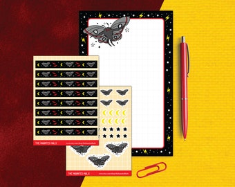 May include: A set of black and yellow patterned stickers featuring a moth, crescent moons, and stars. The stickers are on a white background with a grid pattern. The text "THE HAUNTED HALO" is printed on the bottom of the stickers.