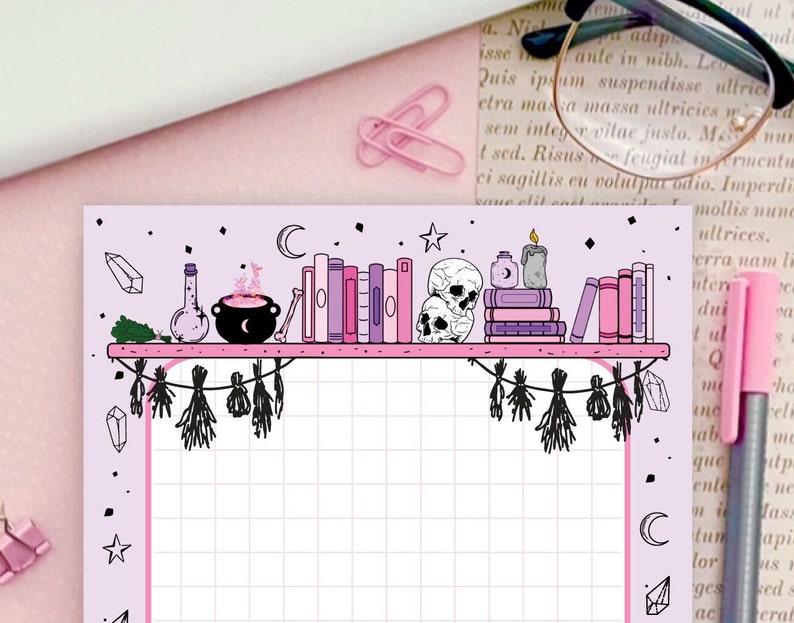 May include: A pink and purple gridded planner page with a shelf of books, a cauldron, a vial, and crystals. The shelf is decorated with hanging dried herbs and a crescent moon.