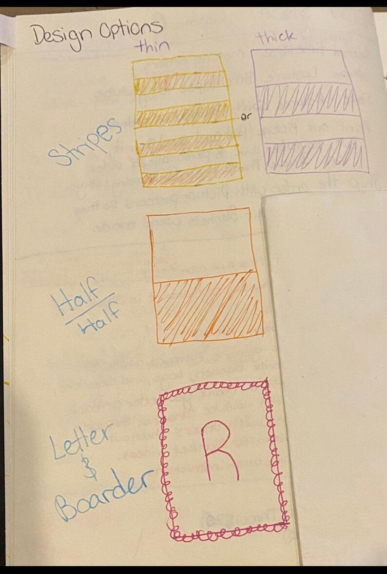 May include: A notebook page with handwritten design options. The options include striped patterns, a half-and-half design, and a letter with a border. The word "Design Options" is written at the top.