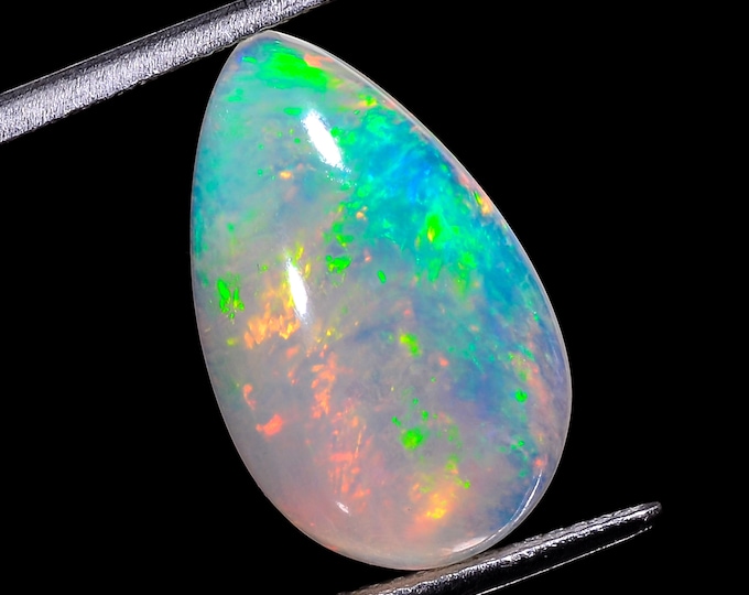 opal raw crystalOpal Cabochon: Stunning Loose Gemstone for Jewelry Making, 6.50Crt,Natural white Rainbow fire Ethiopian opal cabochon.