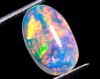 Ethiopian Opal Cabochon: Rainbow Fire Loose Gemstone (4.50 Crt, 17x10x5 mm)