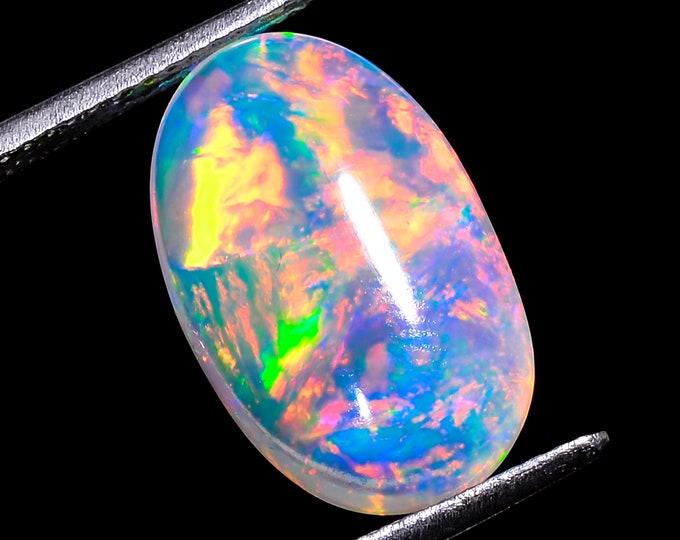 opal raw crystalOpal Cabochon: Stunning Loose Gemstone for Jewelry Making, 4.50Crt,Natural white Rainbow fire Ethiopian opal cabochon.