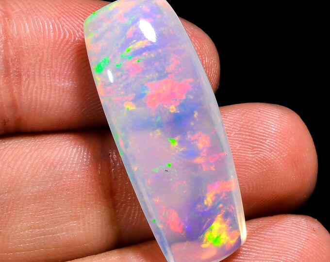 opal raw crystalOpal Cabochon: Stunning Loose Gemstone for Jewelry Making, 16.00 Crt,Natural white Rainbow fire Ethiopian opal cabochon.
