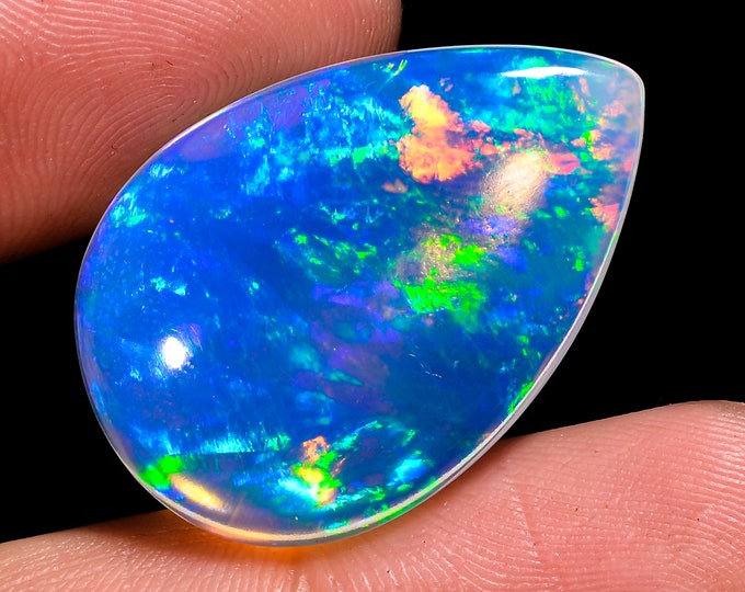 opal raw crystalOpal Cabochon: Stunning Loose Gemstone for Jewelry Making, 19.00 Crt,Natural white Rainbow fire Ethiopian opal cabochon.