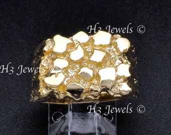May include: A gold nugget ring with a textured surface. The ring is on a black background. H3 Jewels ©