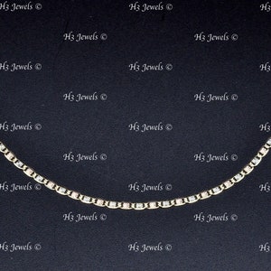 May include: A gold and silver chain necklace with a delicate design. The chain is made of small, round links and has a subtle shimmer.