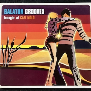 May include: A colorful album cover with a couple dancing in front of a sunset. The album title is "Balaton Grooves" and the subtitle is "loungin' at Café Móló".