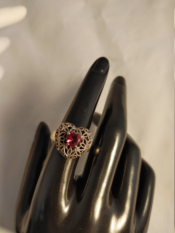 Filagree heart ring with garnet