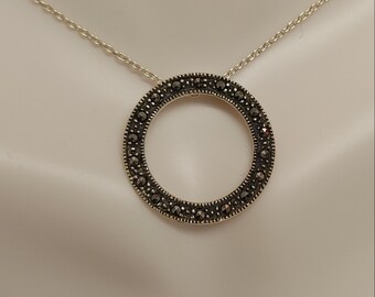 Sterling silver circle pendant with marcasite