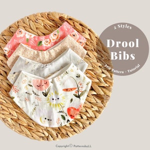 May include: Four baby drool bibs with floral and whimsical patterns are arranged on a woven basket. The bibs feature pink, beige, and white fabrics with rose, dot, and nature-themed designs. Text on the image reads "2 Styles Drool Bibs PDF Pattern + Tutorial."