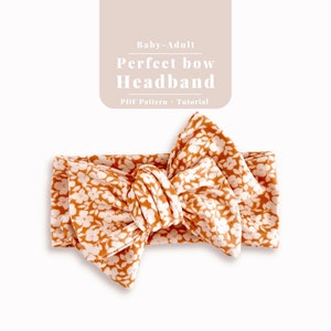 May include: A brown headband with a white floral pattern tied into a large bow. The headband is made of soft, stretchy fabric and is suitable for babies and adults.  PDF Pattern + Tutorial.