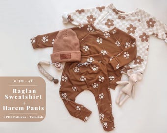May include: A brown raglan sweatshirt and matching brown harem pants with a white floral pattern. The set is laid out on a white background with a brown beanie and a small stuffed animal.