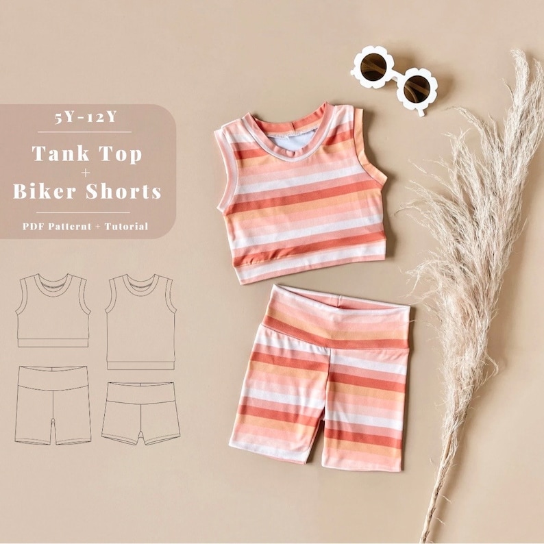 May include: A striped tank top and biker shorts sewing pattern for sizes 5-12 years. The pattern includes a PDF pattern and tutorial. The image shows a white background with a pair of sunglasses, a dried flower, and a mockup of the pattern.