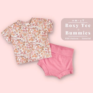 May include: A PDF pattern and tutorial for a boxy tee and bum-length shorts for babies and toddlers, sizes 0-4T. The image shows a white tee with a floral print and pink shorts.