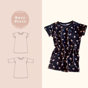 Op de afbeelding: Een zwart-witte lijntekening van een boxy jurk met korte mouwen. De jurk wordt in twee verschillende weergaven getoond, een met opgerolde mouwen en een met neergelaten mouwen. De tekst "Boxy dress" staat in een cirkel boven de tekeningen. De tekst "PDF Pattern - Tutorial" staat onder de tekeningen.