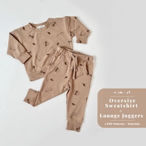 May include: A brown oversized sweatshirt and matching lounge joggers with a print of a cartoon face wearing sunglasses and a skateboard. The text "0/3m - 4T Oversize Sweatshirt + Lounge Joggers 2 PDF Patterns + Tutorials" is printed on a white background.