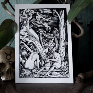 May include: A black and white woodcut print depicting a scene of alchemy. Two figures are shown stirring a cauldron, while a third figure flies overhead with a staff. The print is full of intricate details and symbolism.