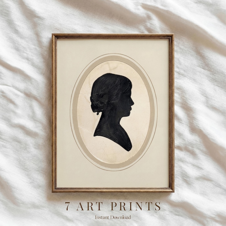 May include: A framed art print featuring a black silhouette of a woman's profile within an oval frame. The print is set against a beige background, with the text "7 ART PRINTS" and "Instant Download" at the bottom. The frame is a warm brown.