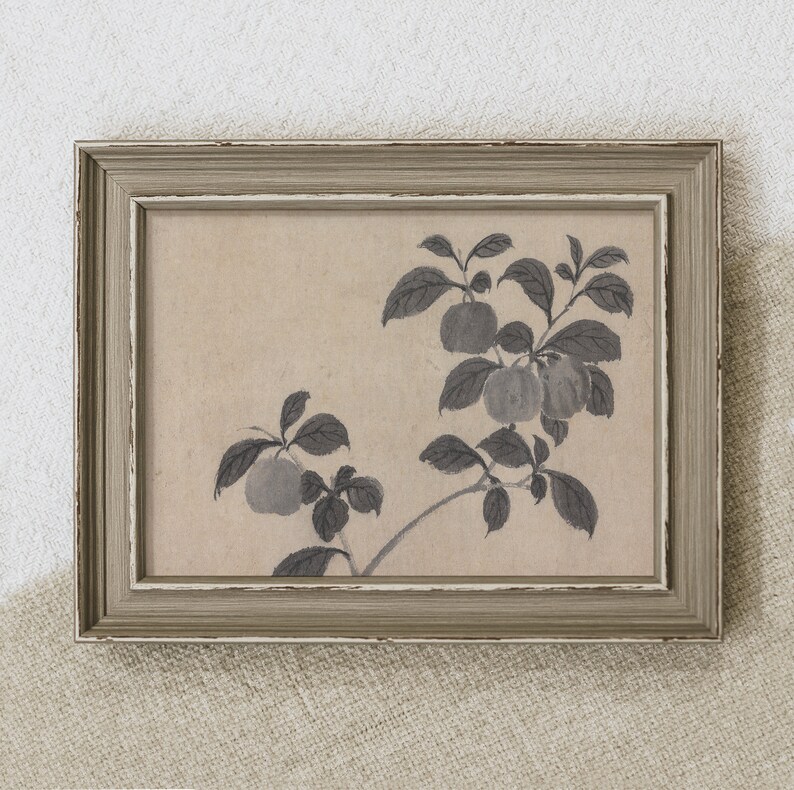 May include: A framed print featuring a botanical illustration of a fruit-bearing branch. The artwork, in shades of gray, depicts apples and leaves against a neutral background. The frame is a distressed gray with a white inner edge, adding a vintage aesthetic.