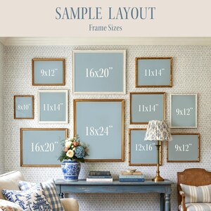 May include: A wall display featuring various framed art pieces in different sizes, including 8x10 inches, 9x12 inches, 11x14 inches, 12x16 inches, 16x20 inches, and 18x24 inches. The frames have gold and white finishes, and the art has a light blue background.