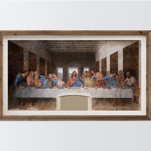 Puede incluir: Una impresión enmarcada de "La Última Cena" de Leonardo da Vinci, con Jesús y sus discípulos en una mesa. La obra de arte está en un marco de madera, con un fondo neutro.