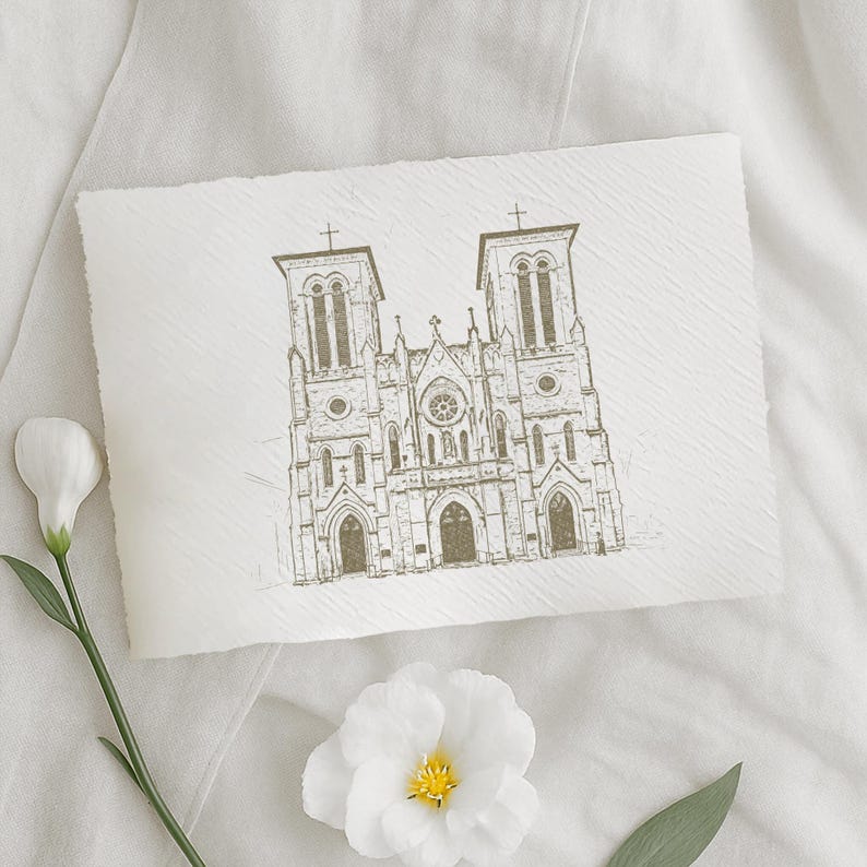 May include: A sepia-toned sketch of a cathedral with two bell towers and a detailed facade. The artwork is on textured paper, with a white flower and stem in the foreground. The overall aesthetic is elegant and artistic.