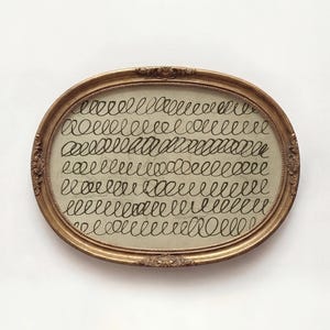 May include: A set of three ceramic mugs with a speckled, matte finish. The mugs are in shades of cream, light gray, and dark gray. Each mug has a simple, minimalist design and a rounded handle.