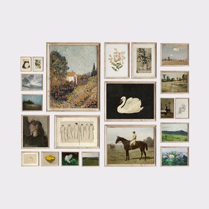 May include: A gallery wall with a variety of framed artwork, including landscapes, still lifes, and abstract pieces. The frames are all in a similar style, with a light wood finish.