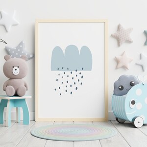 May include: A framed print featuring a blue cloud with rain drops, displayed in a child's room. The room is decorated with star-shaped wall hangings, a teddy bear, a whale-shaped toy, and a round rug.