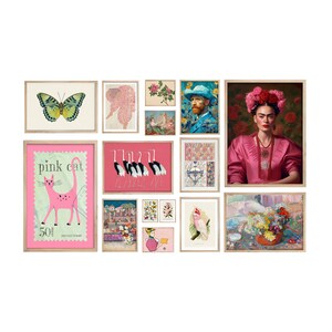 May include: A gallery wall featuring a variety of framed prints, including a pink cat, a butterfly, a floral design, a portrait of Frida Kahlo, a portrait of Vincent van Gogh, and a still life with flowers.