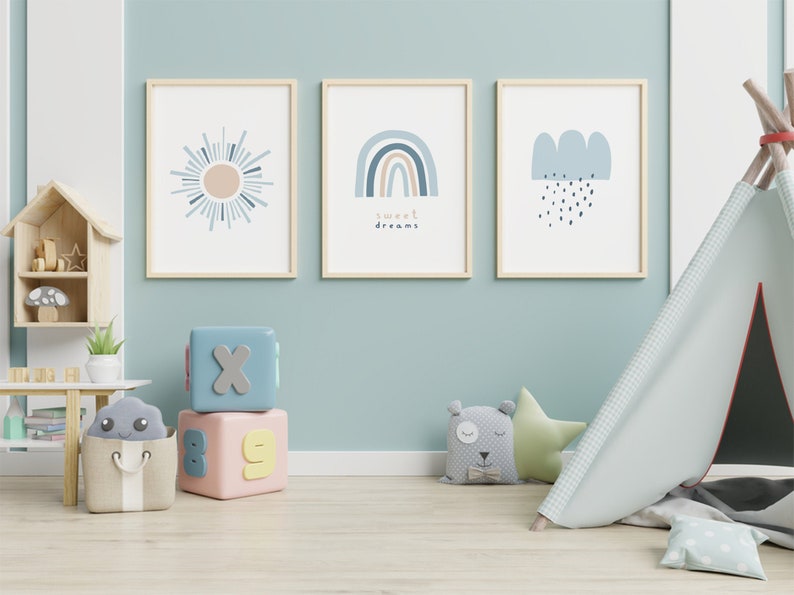 May include: Three framed art prints with a sun, rainbow, and cloud design in a child's room. The rainbow print has the words "sweet dreams". The room also has a play tent, blocks, and stuffed animals.