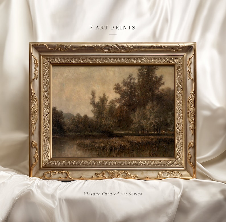 May include: A framed landscape art print with a gold ornate frame. The artwork depicts a serene scene of trees and a body of water. The text "7 ART PRINTS" and "Vintage Curated Art Series" are visible.