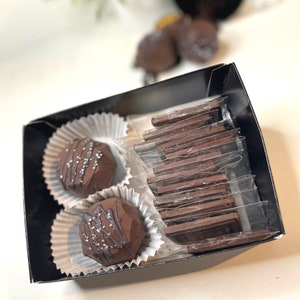 Twelve (12) Espresso Chocolate Bars with Chopped Espresso Beans (individually wrapped) & 2 Espresso Coffee Bombs packaged in black gift box.