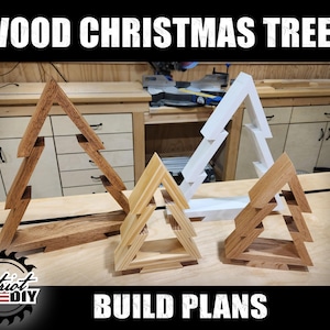 May include: Four wooden Christmas tree ornaments in various sizes and finishes. The trees are made of layered wood and have a simple, modern design. The text "BUILD PLANS" is visible at the bottom of the image.