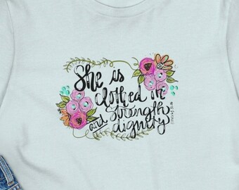 She is clothed in strength and dignity T-shirt