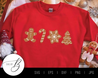 May include: Red sweatshirt with a gingerbread man, candy cane, snowflake, and Christmas tree design. The design is in brown and white.