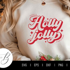 May include: A white sweatshirt with the text "Have a Holly Jolly Christmas" in red lettering. The text is in a retro font style.