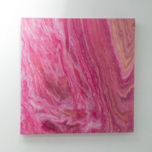 May include: Abstract painting featuring pink, white and orange colours. The paint is swirled and layered to create a marbled effect.