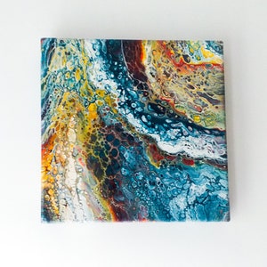May include: Abstract painting with swirling patterns in shades of blue, yellow, white, and red. The painting has a textured, almost bubbly appearance.