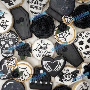 May include: An assortment of black and white decorated cookies. Designs include skulls, roses, coffins, engagement rings with spiderwebs, and heart-shaped cookies with skeleton hands. Some cookies have the text "'Til Death Do Us Part".