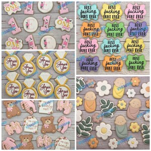 May include: Assortment of decorated sugar cookies with various themes, including "She Said Yes", "Best Aunt Ever", "Miss One", "We Can Barely Wait", and baby-themed designs. The cookies are decorated with colorful icing and various designs.