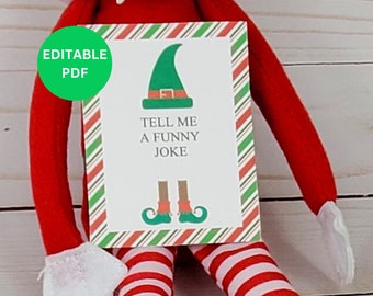May include: Printable Elf on the Shelf Christmas activity card with a green elf hat and the text "Tell me a funny joke".