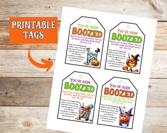 Könnte beinhalten: Druckbare Halloween-Tags mit dem Text "You've Been Boozed". Jedes Tag zeigt eine andere Halloween-Cocktail-Illustration. Die Tags sind orange, grün und lila.