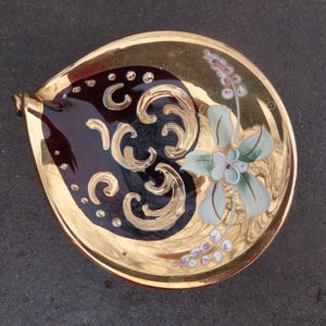 May include: A set of three ceramic nesting bowls in shades of blue, green, and white. The bowls feature a speckled glaze and a simple, modern design. The largest bowl is approximately 6 inches in diameter.